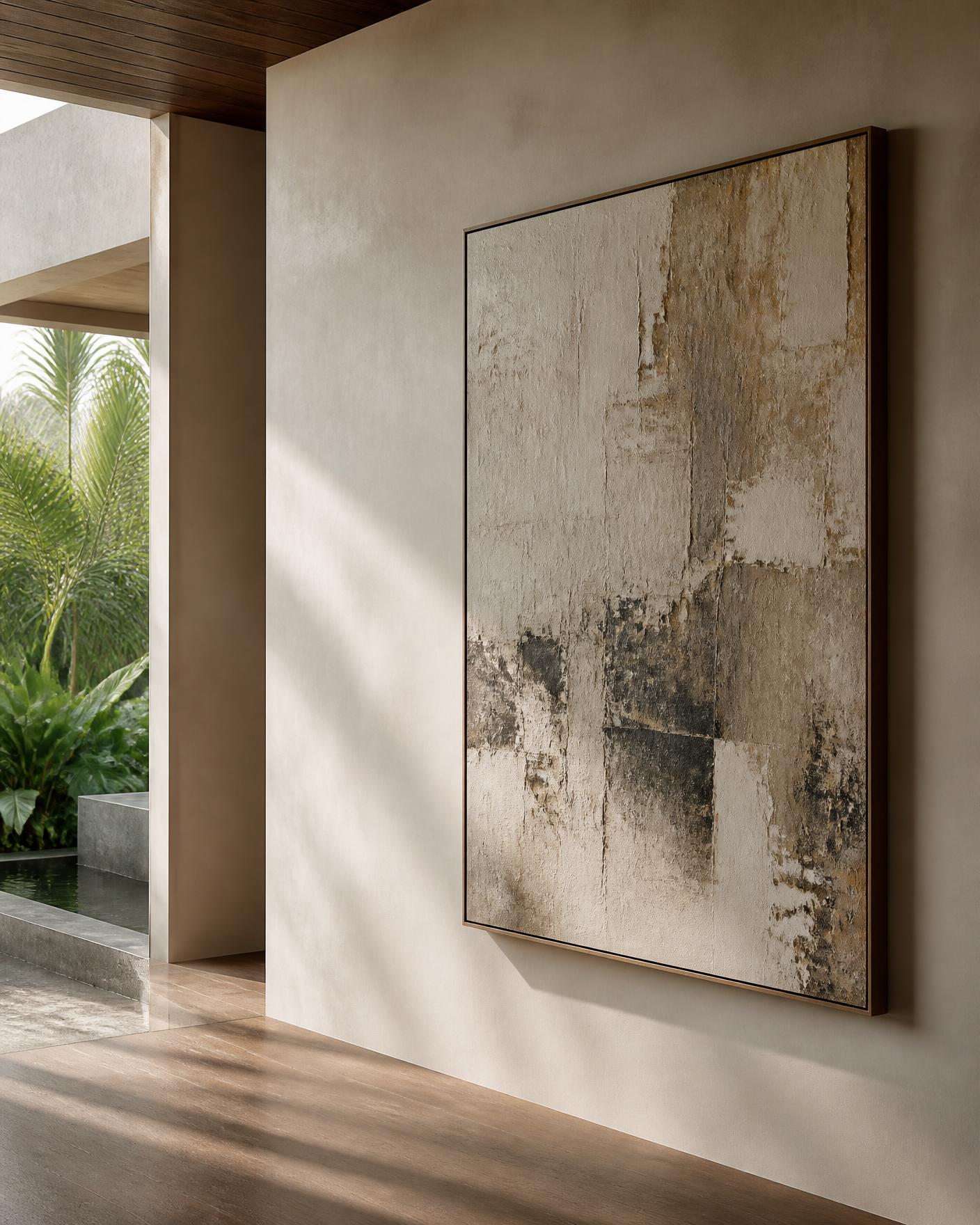 A large textural abstract painting on a plaster wall in a tropical modernist villa, raking daylight across teak flooring